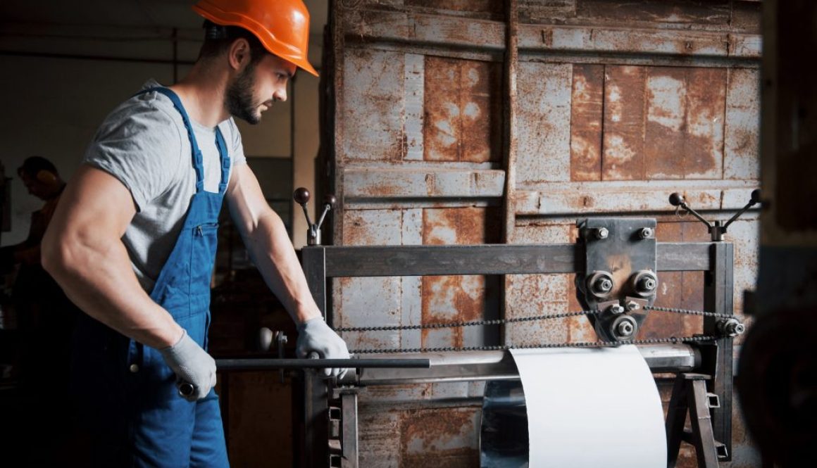 portrait-young-worker-hard-hat-large-metalworking-plant