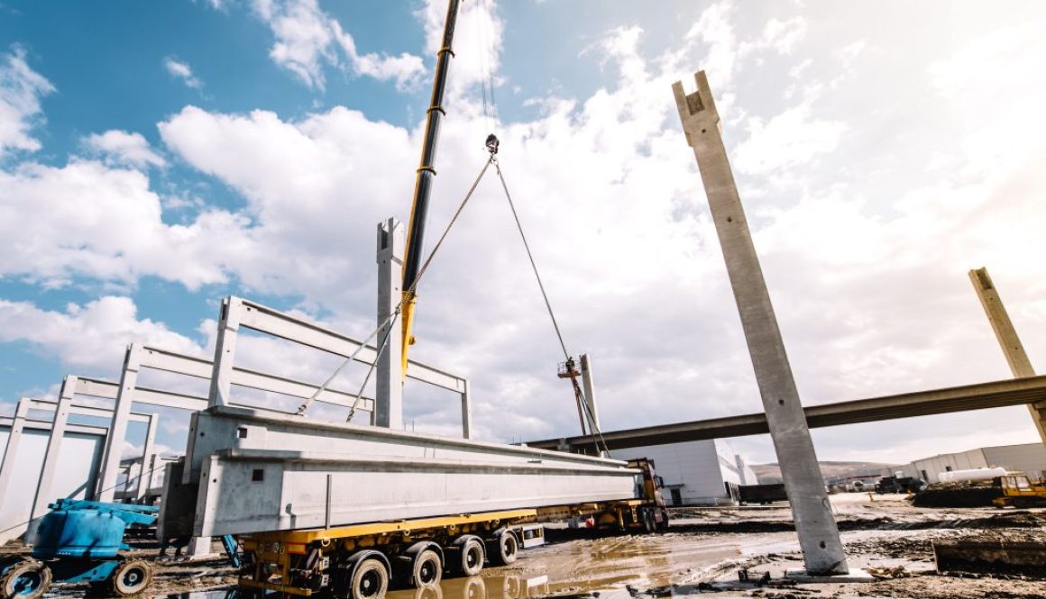 Details and tools on construction site with crane lifting prefabricated concrete framework, unloading and cargo details